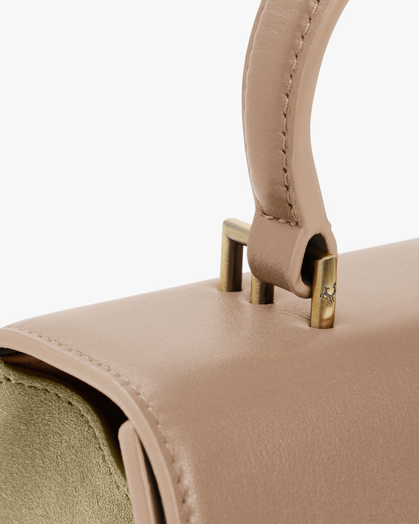 ALEXIA bag in Beige, close-up on the handle attachment and gold hardware