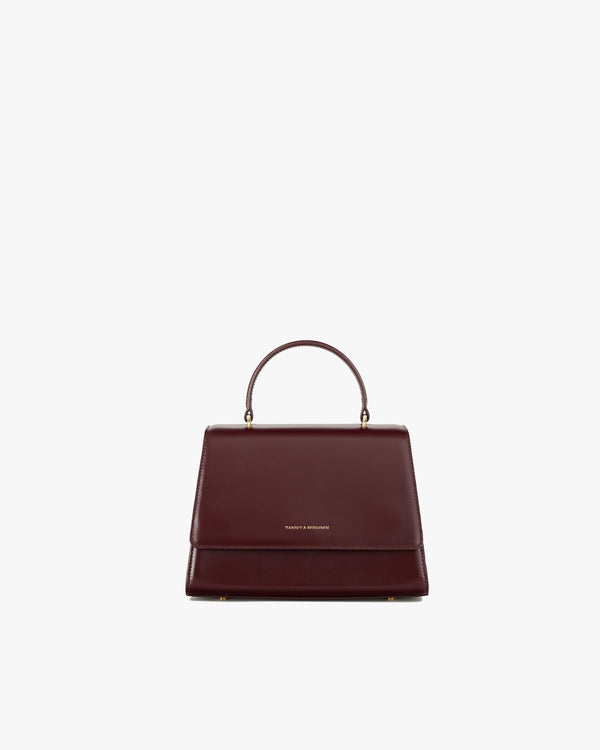 ALEXIA bag in Mahogany, front view, flap closed, structured handle up, on white background