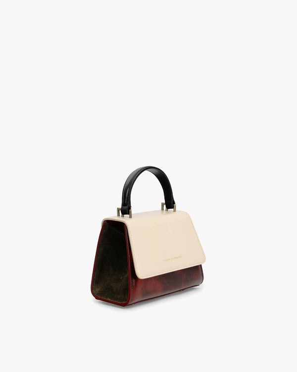 ALEXIA NANO bag in Colourblock art déco, three-quarter view, black handle, cream flap and burgundy body