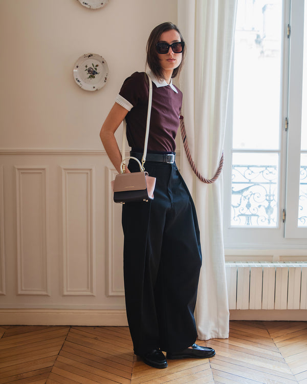 ALEXIA NANO Colourblock Marlowe bag worn crossbody with top handle, styled with black and burgundy outfit