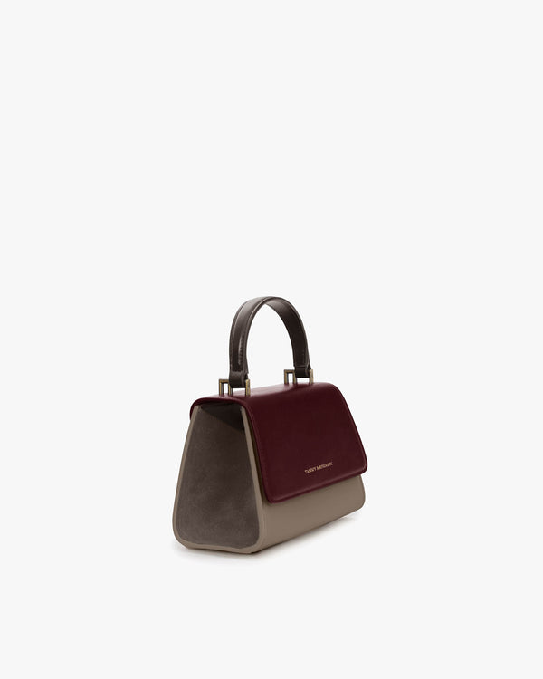 ALEXIA NANO bag in Colourblock Stratum, three-quarter view, top handle, burgundy flap and taupe sides