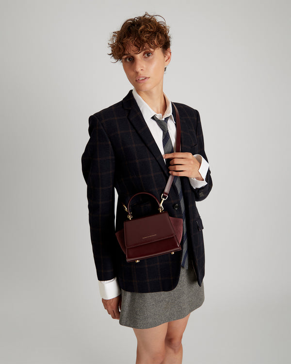 ALEXIA NANO bag in Mahogany worn crossbody, front view on a model
