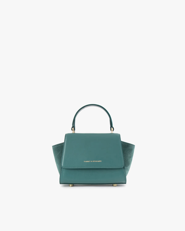 ALEXIA NANO bag in turquoise, front view, standing, short handle upright, flap closed