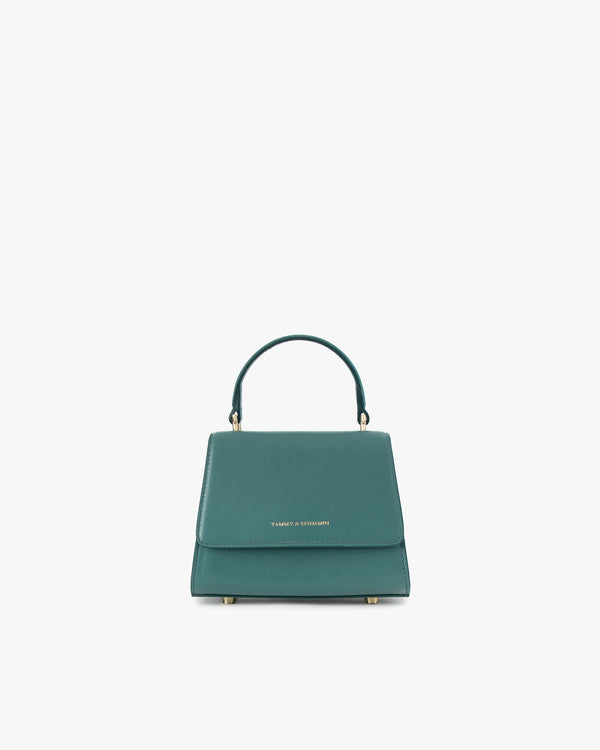 ALEXIA NANO bag in turquoise, front view, standing, top handle up