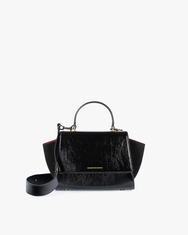 ALEXIA bag in black naplak, front view with top handle and detachable strap laid flat