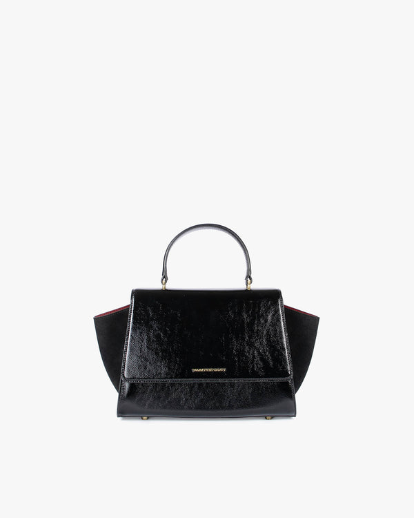 ALEXIA bag in black naplak, front view, gathered handle, side wings tucked in