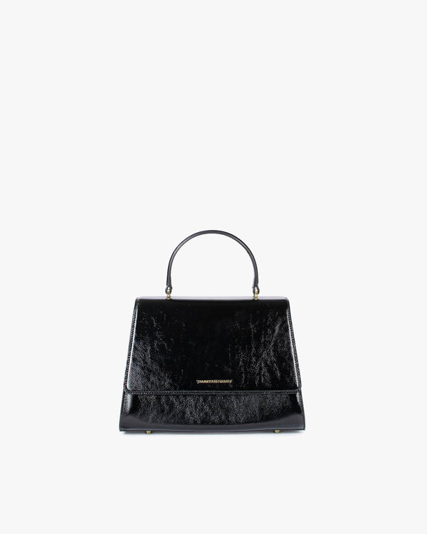 ALEXIA bag in black naplak, front view, standing, with top handle and closed flap