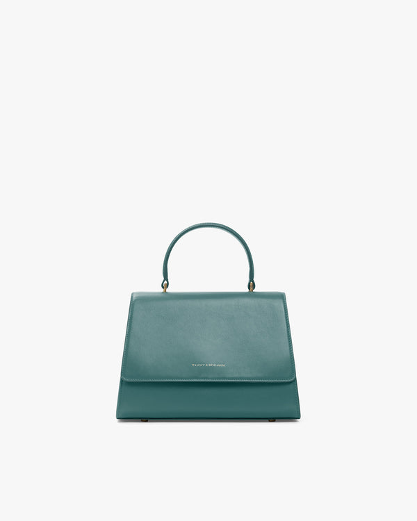 ALEXIA bag in turquoise, front view, standing, top handle up, flap closed