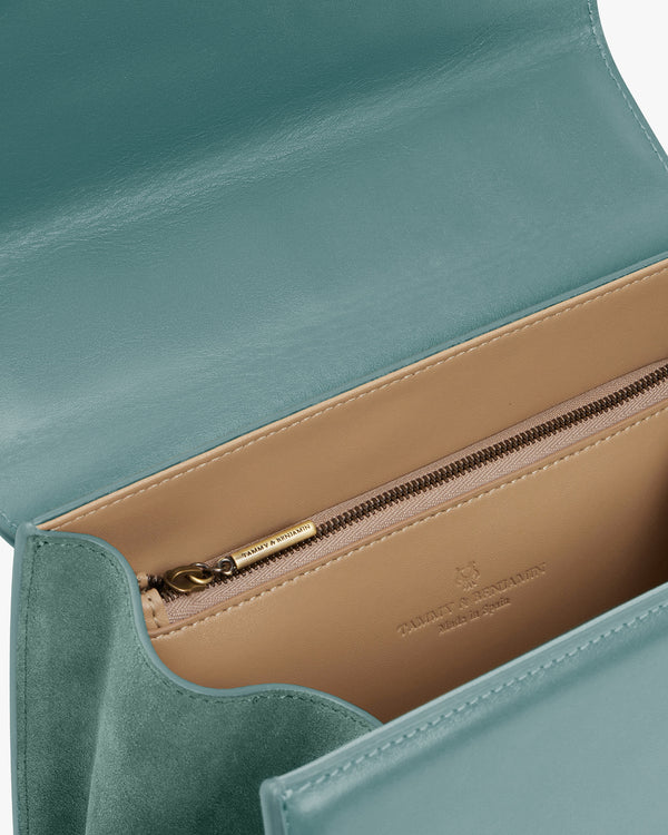 ALEXIA bag in Turquoise, interior view, open flap showing beige lining and zip pocket