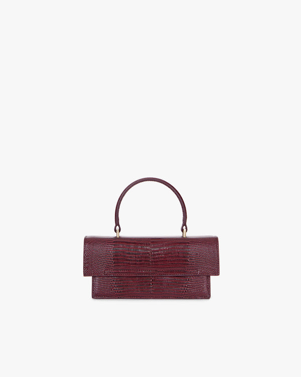 THEA MINI bag in Bordeaux embossed lizard, front view, handle raised, oversized flap closed