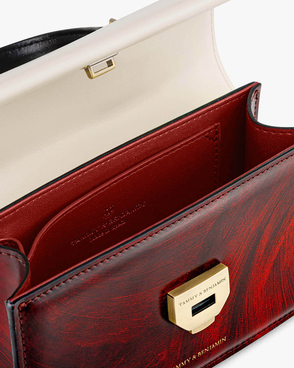 THEA MINI Colourblock art déco bag open, inside view with white flap and red pocket, gold clasp