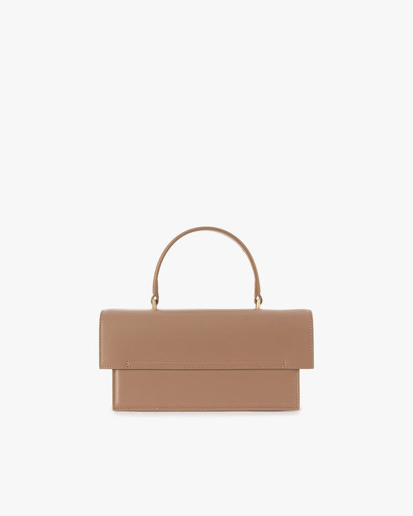 THEA Beige bag, front view, top handle raised, oversized flap closed
