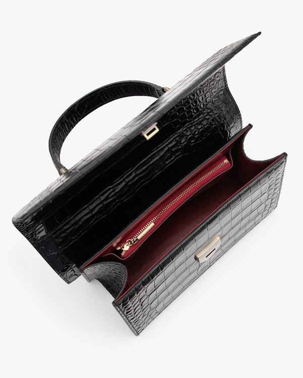 THEA bag in black embossed crocodile, open interior view with red zip pocket and top handle