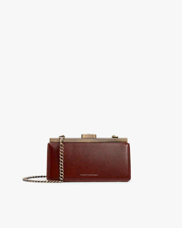 JEANNE BAGUETTE bag in brown, front view with gold-tone clasp and detachable chain strap