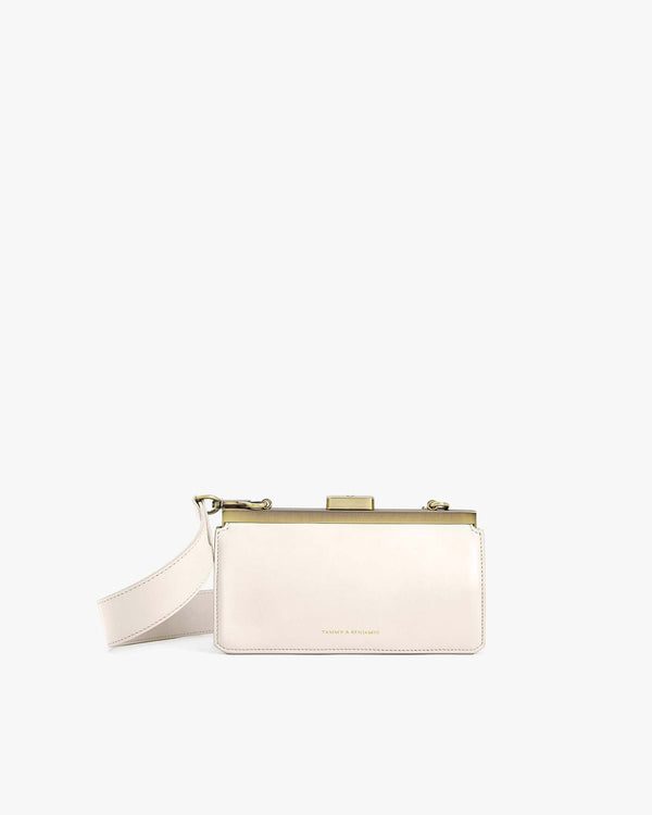 JEANNE BAGUETTE bag in Ivory, front view, standing, gold retro clasp and adjustable strap
