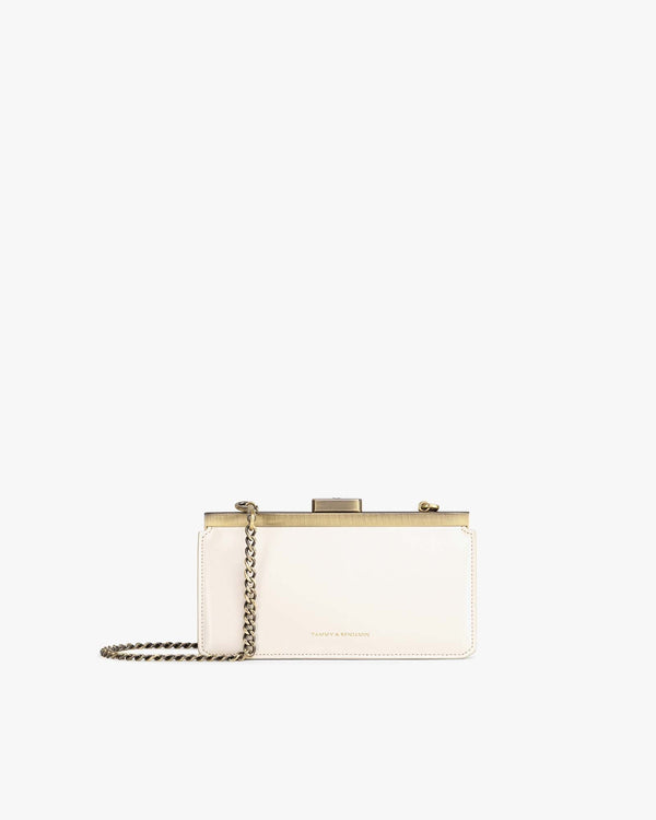 JEANNE BAGUETTE bag in ivory, front view with gold clasp and removable chain
