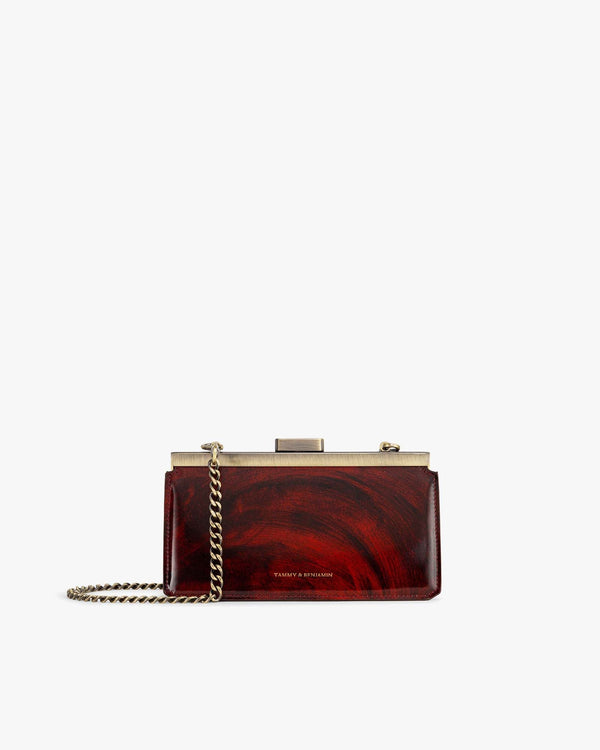 JEANNE BAGUETTE bag in marbled leather, front view with gold retro clasp and chain strap
