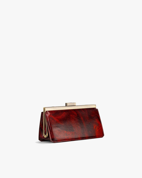 JEANNE BAGUETTE bag in red marbled leather, three-quarter view, gold retro clasp detail