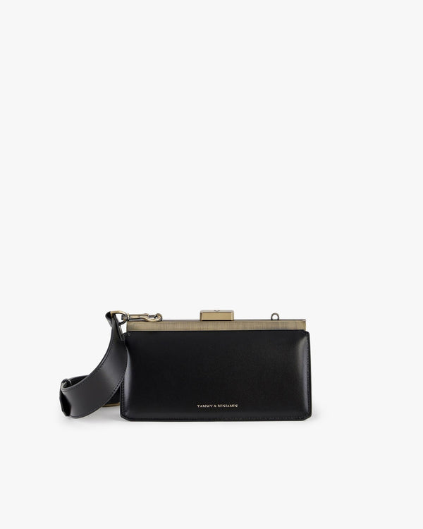 JEANNE BAGUETTE bag in black, front view, gold-tone retro clasp, worn with shoulder strap