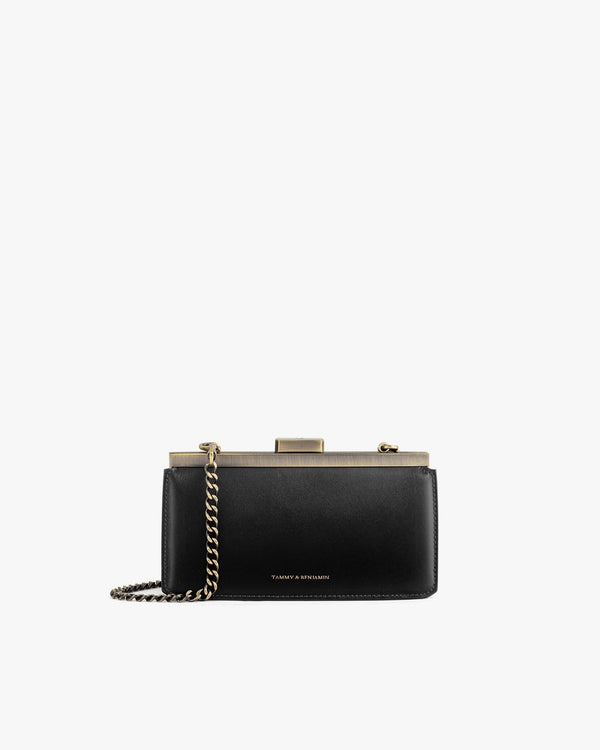 JEANNE BAGUETTE bag in black, front view with gold-tone clasp and removable chain
