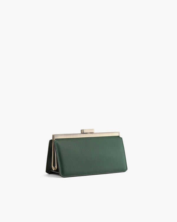 JEANNE BAGUETTE bag in emerald green, angled view, standing, gold retro clasp visible