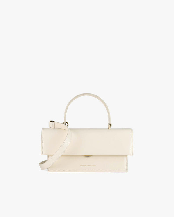 THEA bag in Ivory, front view, oversized flap, rigid handle and detachable strap