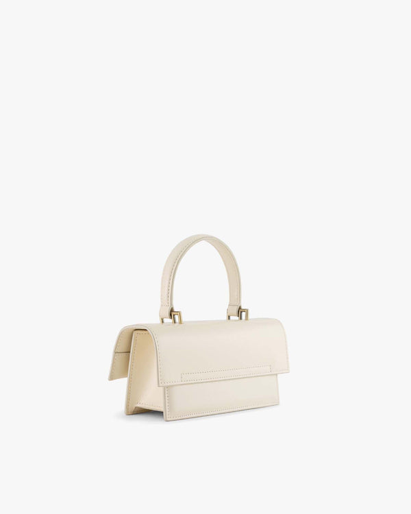 THEA MINI bag in Ivory, side view, oversized flap and rigid top handle